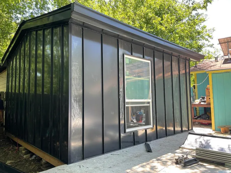 Black standing seam metal wall panels for Metal Roof Installation in Eastham